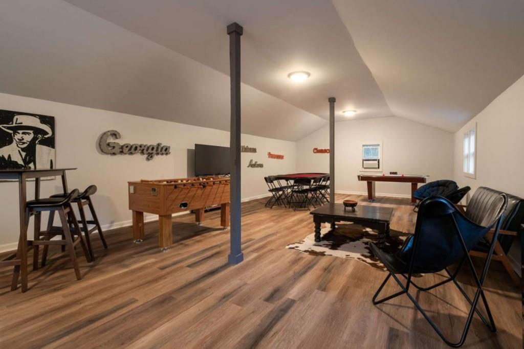230 Old Mill White Road Jasper, GA 30143 - Photo 46 of 65 a living room with couches a coffee table and chairs with wooden floor