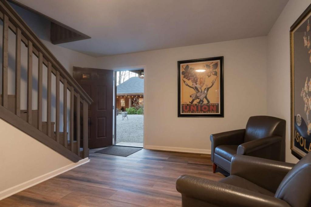230 Old Mill White Road Jasper, GA 30143 - Photo 49 of 65 a living room with couches and a painting on the wall
