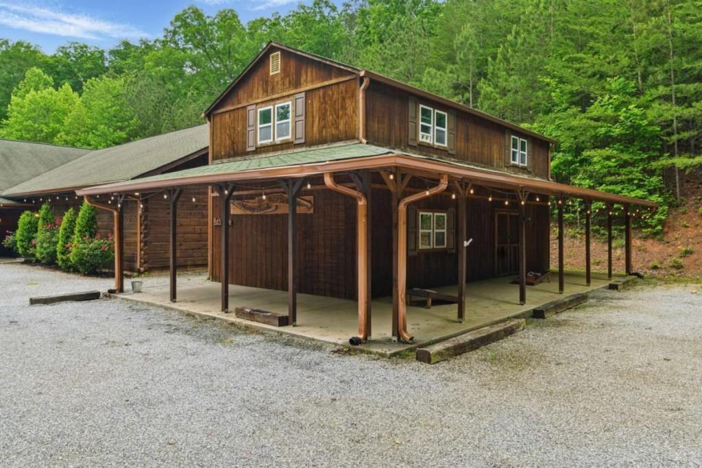 230 Old Mill White Road Jasper, GA 30143 - Photo 51 of 65 a view of a house with a porch and floor to ceiling window