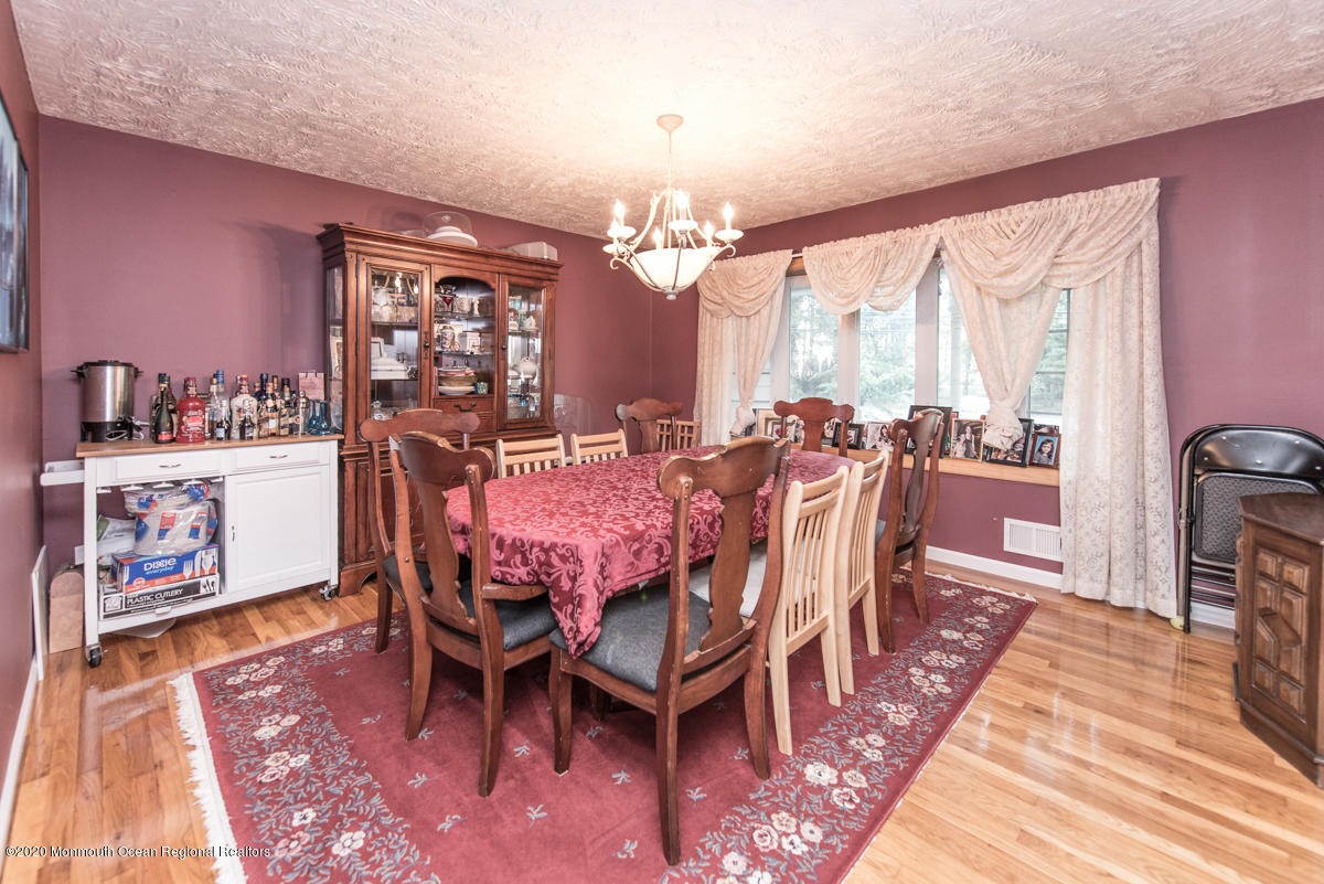 138 Frank Applegate Road Jackson, NJ 08527 - Photo 11 of 47 a view of a dining room with furniture and a chandelier