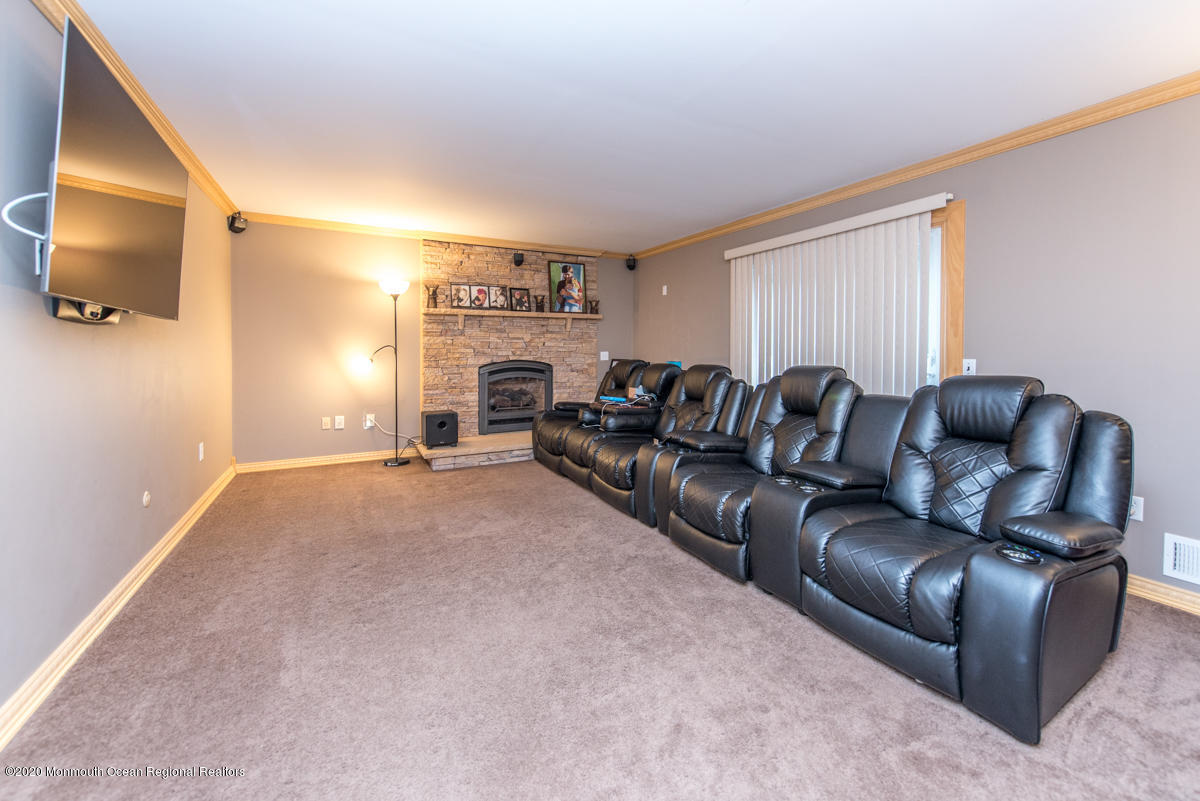 138 Frank Applegate Road Jackson, NJ 08527 - Photo 14 of 47 a living room with furniture and a flat screen tv