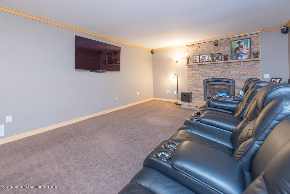 138 Frank Applegate Road Jackson, NJ 08527 - Photo 15 of 47 a living room with furniture and a fireplace