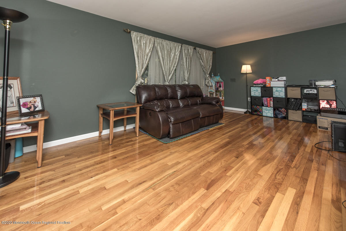 138 Frank Applegate Road Jackson, NJ 08527 - Photo 22 of 47 a living room with furniture and a wooden floor