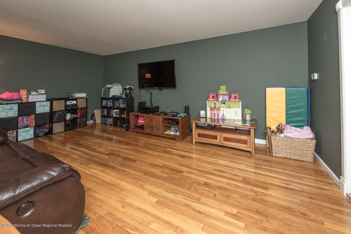 138 Frank Applegate Road Jackson, NJ 08527 - Photo 23 of 47 a living room with furniture and a flat screen tv
