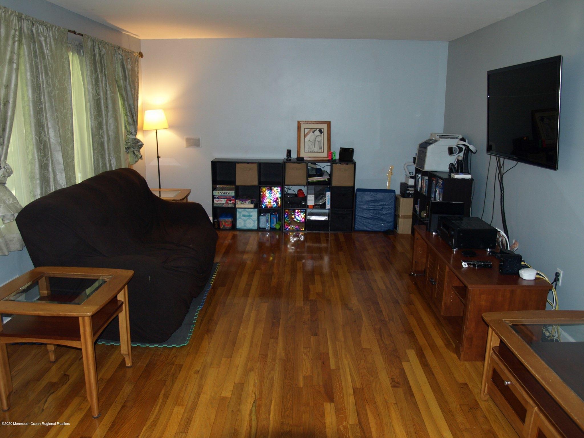 138 Frank Applegate Road Jackson, NJ 08527 - Photo 24 of 47 a living room with furniture and a flat screen tv