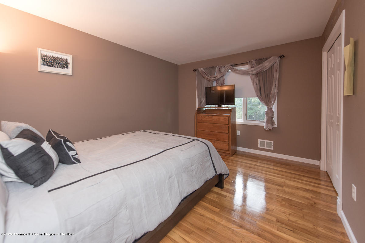 138 Frank Applegate Road Jackson, NJ 08527 - Photo 30 of 47 a bedroom with a bed and a dresser