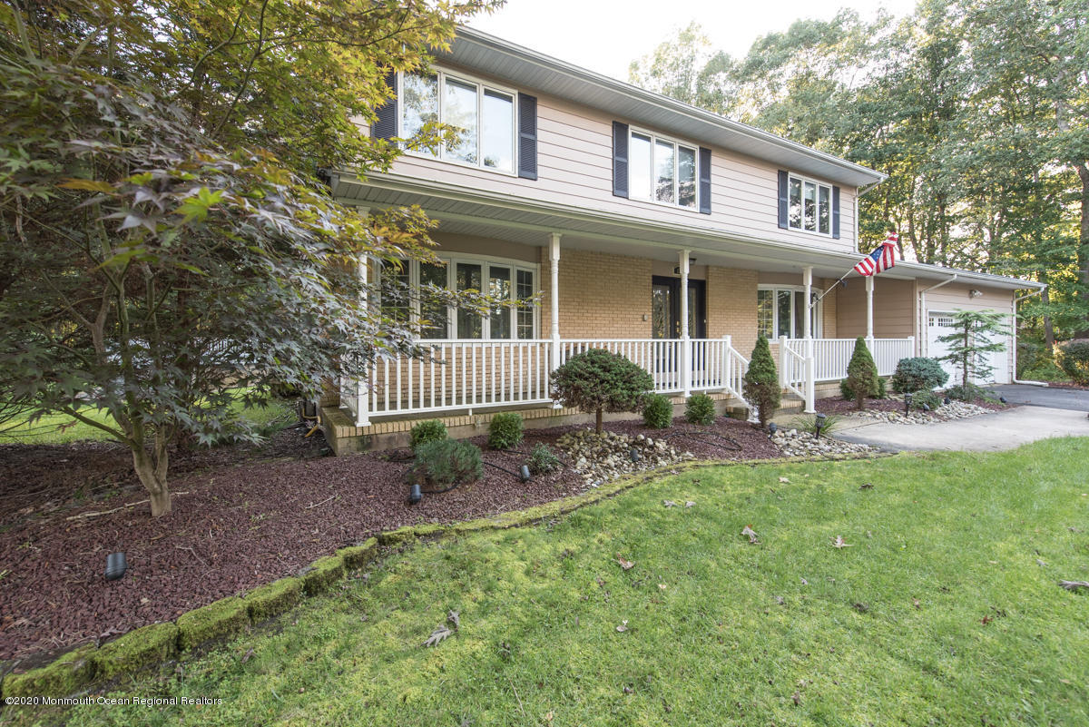 138 Frank Applegate Road Jackson, NJ 08527 - Photo 3 of 47 a front view of a house with outdoor seating yard and garden