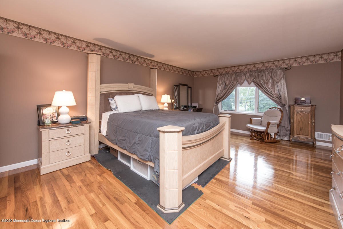138 Frank Applegate Road Jackson, NJ 08527 - Photo 32 of 47 a spacious bedroom with a bed and a dresser