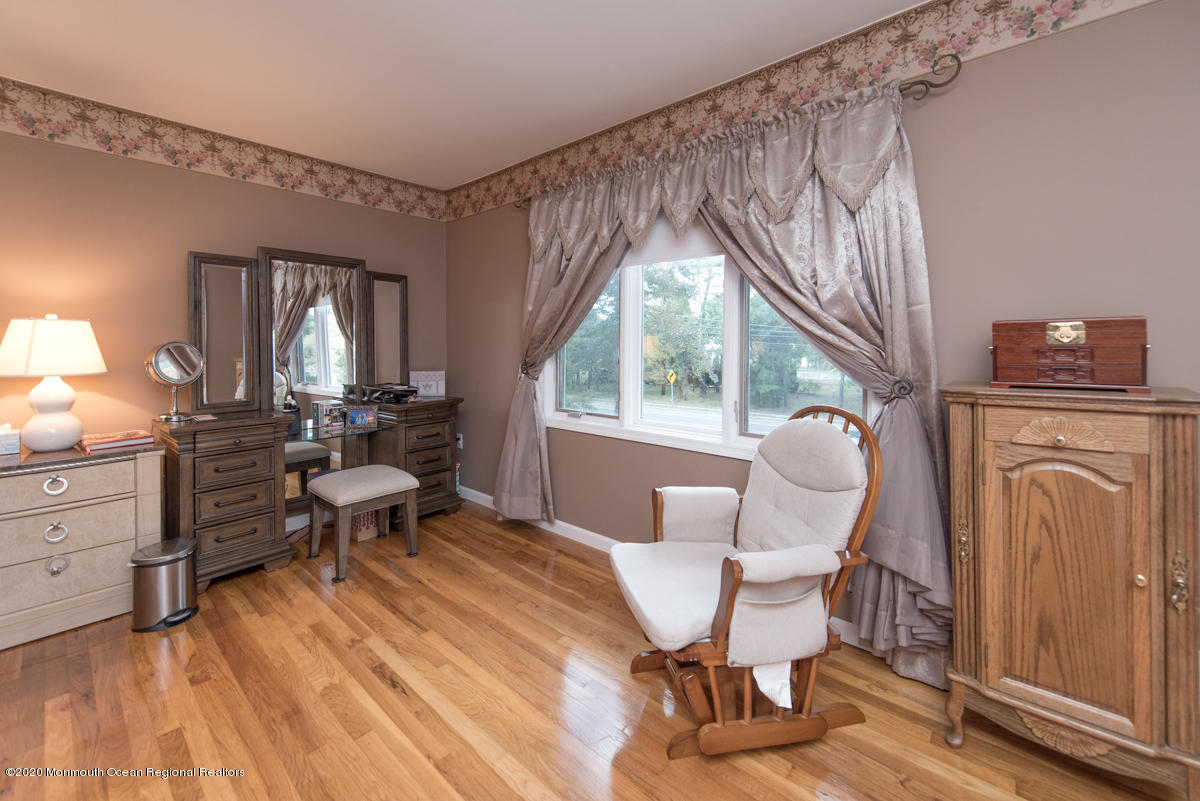 138 Frank Applegate Road Jackson, NJ 08527 - Photo 33 of 47 a living room with furniture a window and a chandelier