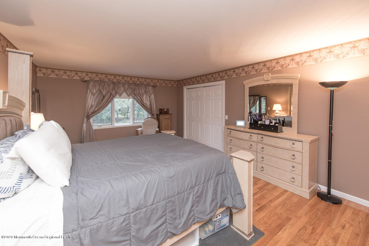 138 Frank Applegate Road Jackson, NJ 08527 - Photo 34 of 47 a bedroom with a bed and a dresser