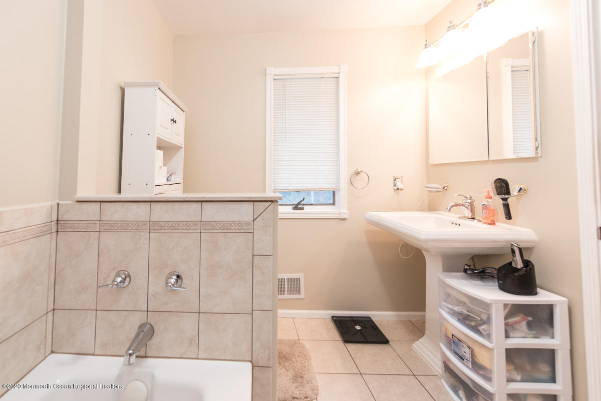 138 Frank Applegate Road Jackson, NJ 08527 - Photo 37 of 47 a bathroom with a sink and a mirror