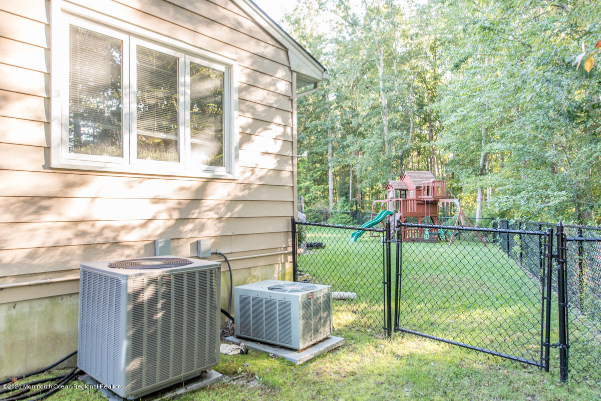 138 Frank Applegate Road Jackson, NJ 08527 - Photo 47 of 47 a view of a wooden house with a sink and a yard