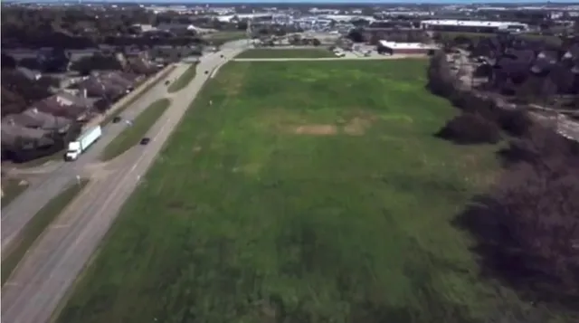 a view of a lake with a city