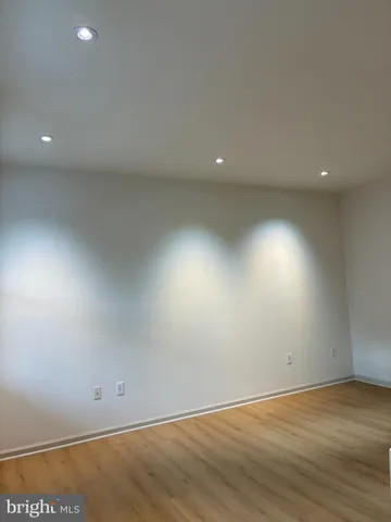 a view of an empty room with windows
