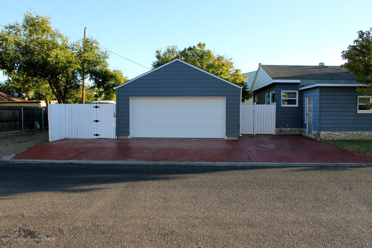 4101 Cline Road Amarillo, TX 79110 - Photo 4 of 27 a front view of house with yard and trees in the background