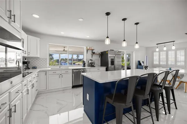 a kitchen with a table and chairs in it