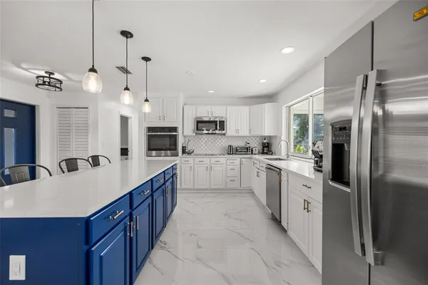 a kitchen with sink cabinets and window