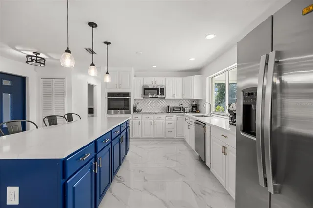 a kitchen with sink cabinets and window