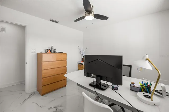 a view of a workspace with furniture