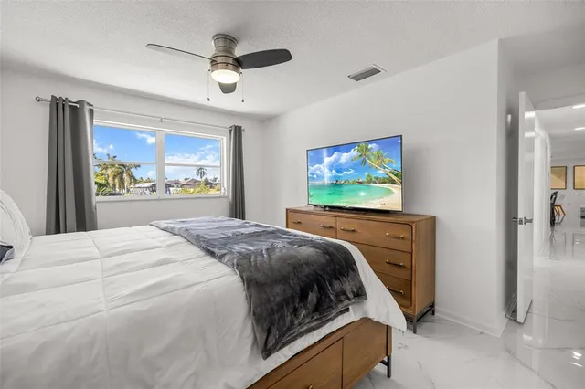 a bedroom with a bed and cabinet