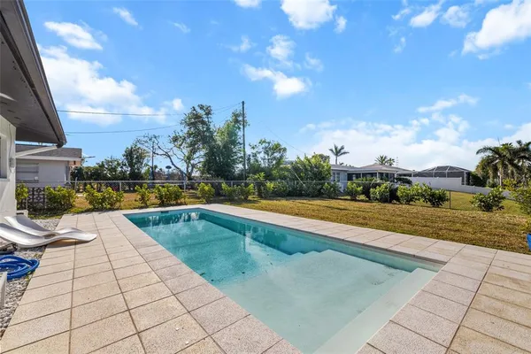 a front view of a house with a yard and a garage