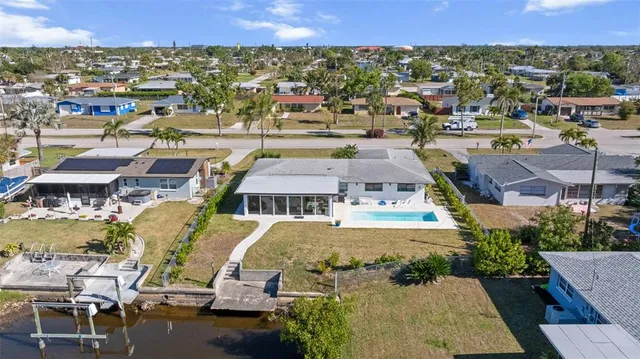 an aerial view of a house with a garden