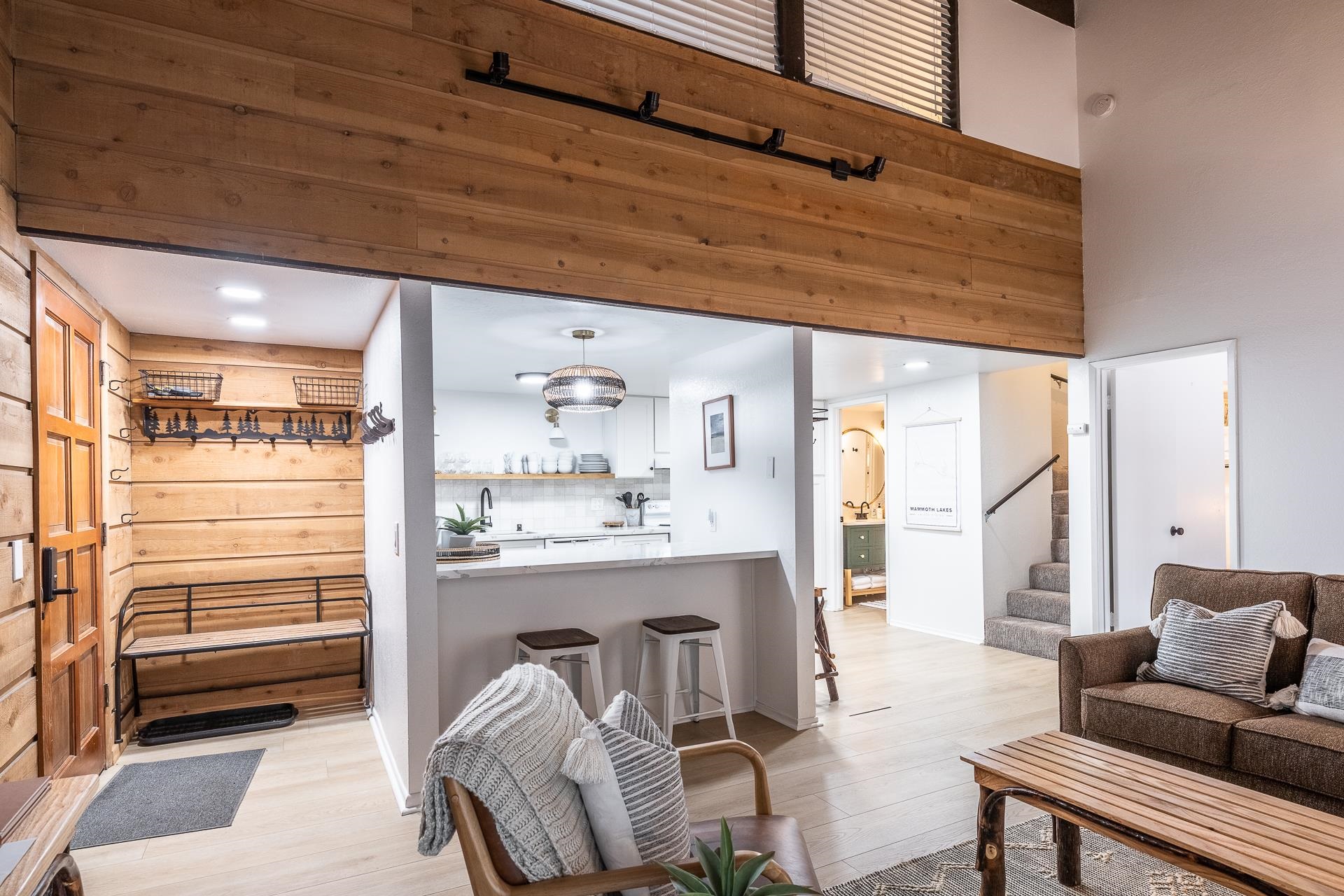 2289 Sierra Nevada Road, Unit J8 Mammoth Lakes, CA 93546 - Photo 18 of 30 Living area featuring light wood finished floors, a high ceiling, and recessed lighting
