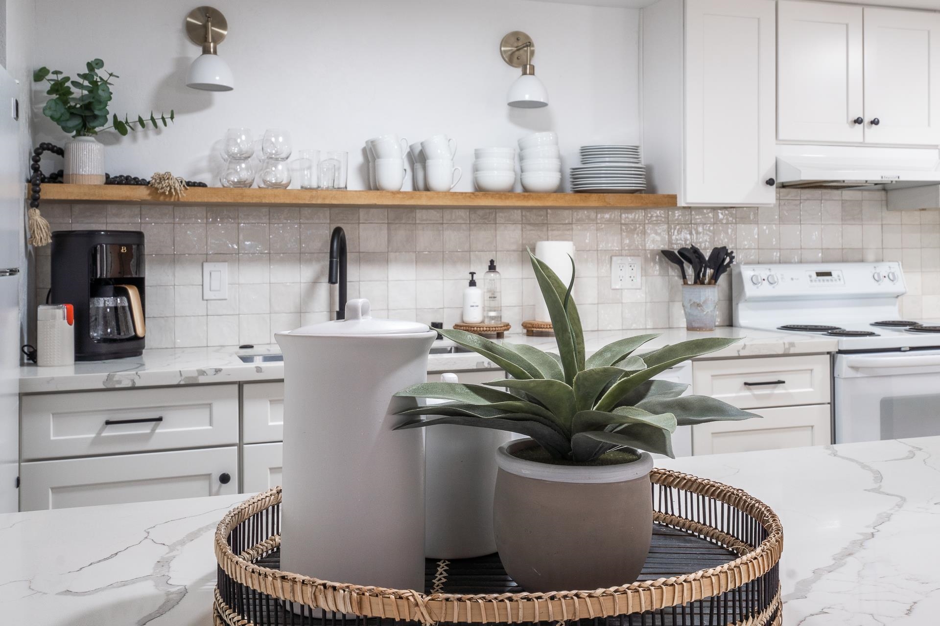 2289 Sierra Nevada Road, Unit J8 Mammoth Lakes, CA 93546 - Photo 8 of 30 Kitchen featuring open shelves and white cabinets