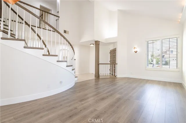 a view of an entryway with wooden floor