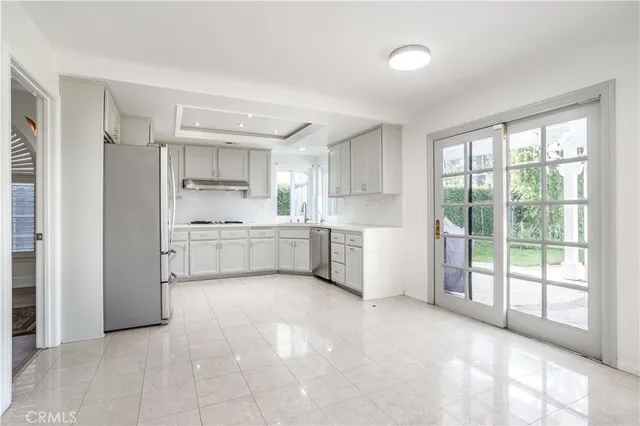 a kitchen with a window a sink and a cabinets