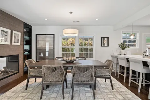 a view of a dining room with furniture window and outside view