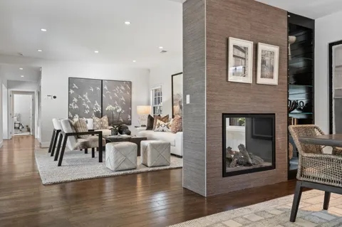 a view of a livingroom with furniture and a fireplace