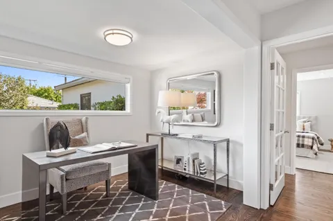 a view of a dining room with furniture window and wooden floor