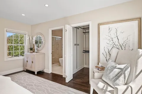 a view of livingroom with furniture window and front door
