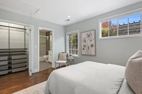 a bedroom with a large bed and a window