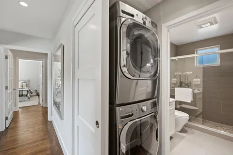 a view of a hallway with washer and dryer
