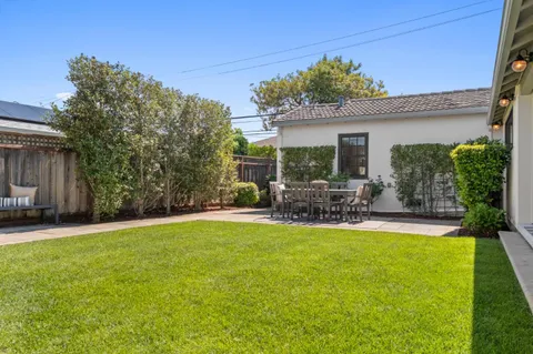 a view of a house with swimming pool and porch