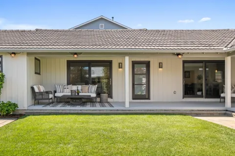 a view of swimming pool with patio