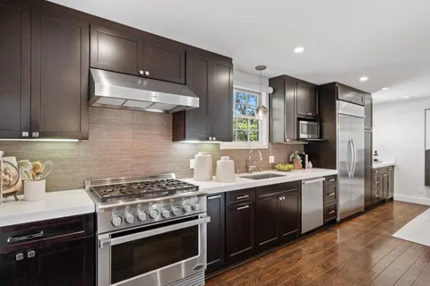 a kitchen with a stove and a sink