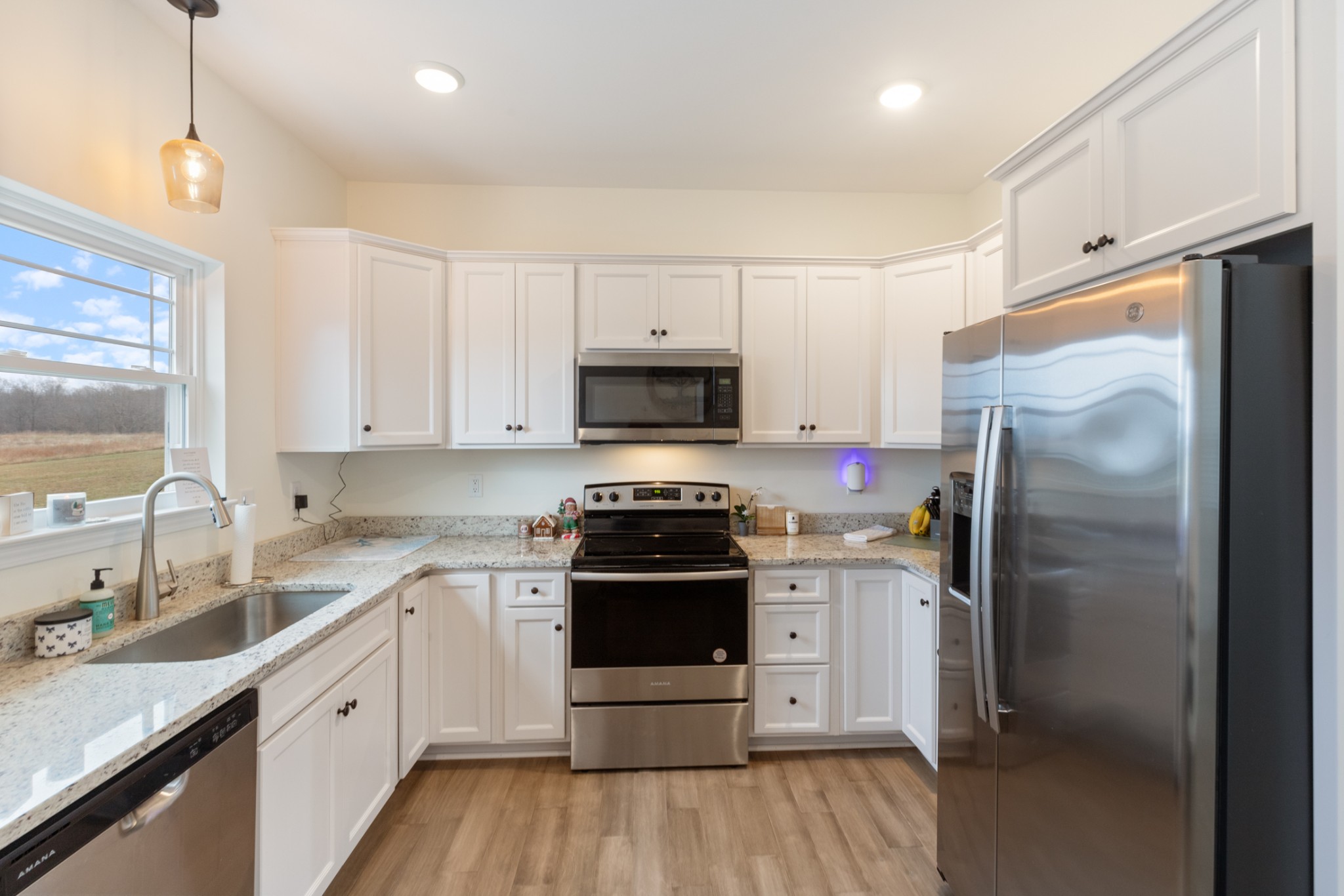 1159 Oak Grove Road Dickson, TN 37055 - Photo 11 of 29 a kitchen with a stove a sink and a refrigerator