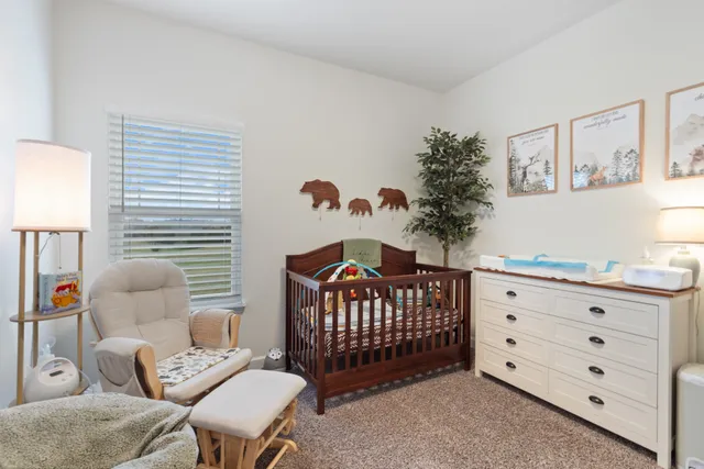 a bedroom with furniture and a window