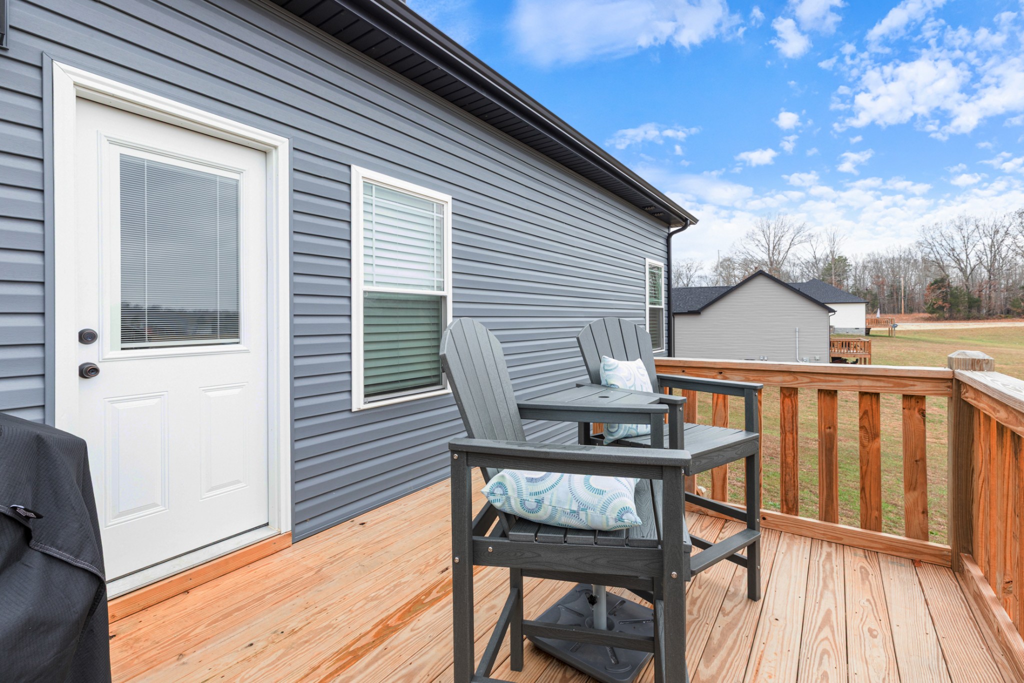 1159 Oak Grove Road Dickson, TN 37055 - Photo 25 of 29 a view of a wooden chairs and table in the balcony