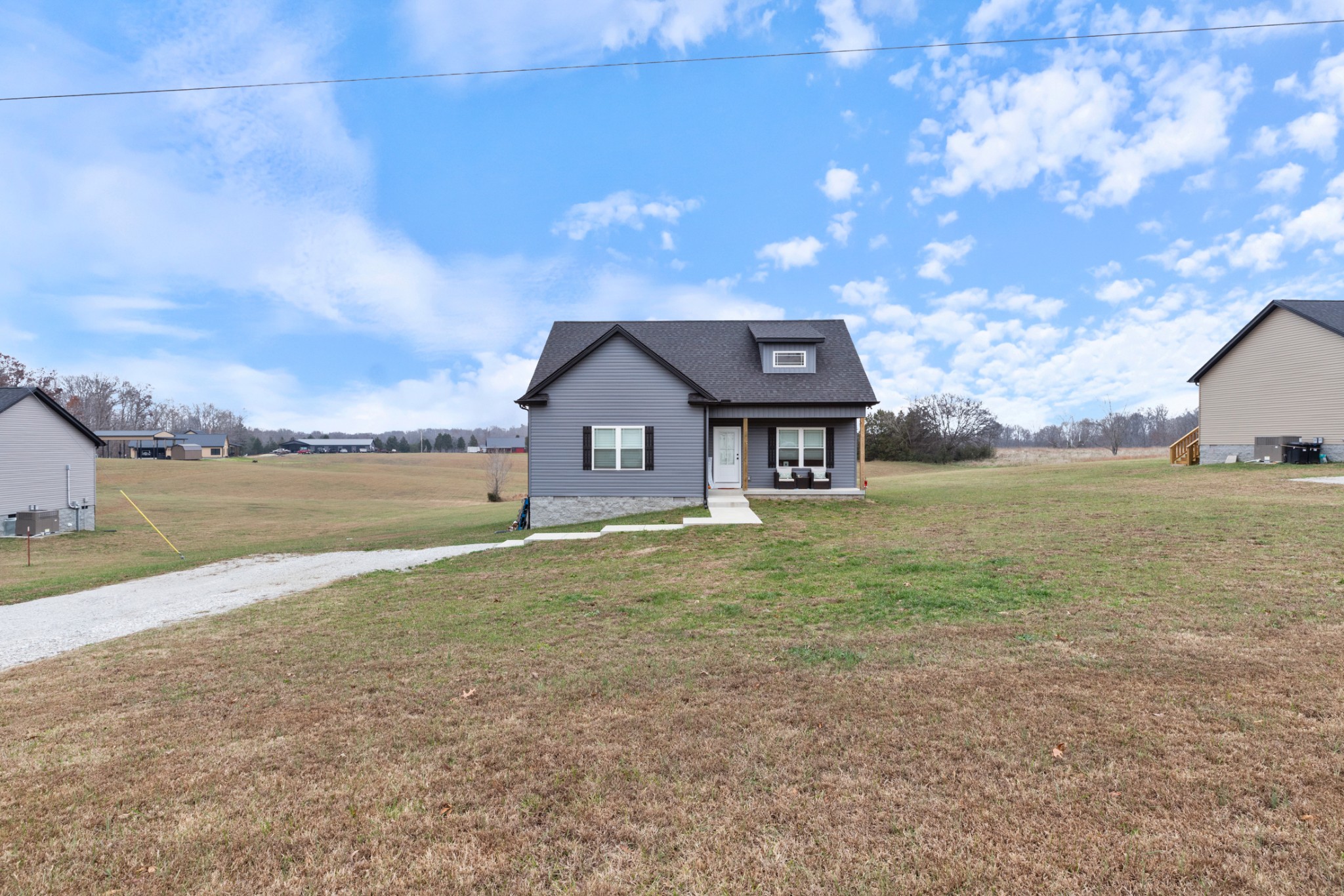 1159 Oak Grove Road Dickson, TN 37055 - Photo 4 of 29 a front view of a house with a yard