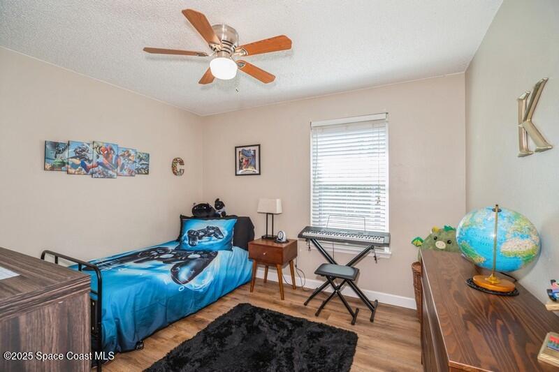 1192 Winding Meadows Road Rockledge, FL 32955 - Photo 18 of 31 18_1192WindingMeadowsRd_154_3rdBedroom_F