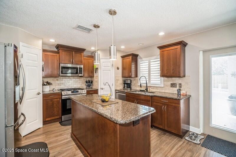1192 Winding Meadows Road Rockledge, FL 32955 - Photo 4 of 31 04_1192WindingMeadowsRd_5_Kitchen_FlexML