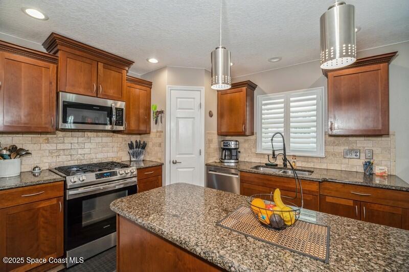 1192 Winding Meadows Road Rockledge, FL 32955 - Photo 5 of 31 05_1192WindingMeadowsRd_177001_Kitchen_F