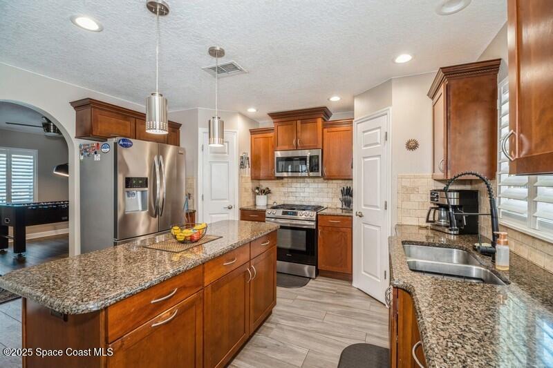 1192 Winding Meadows Road Rockledge, FL 32955 - Photo 6 of 31 06_1192WindingMeadowsRd_177002_Kitchen_F