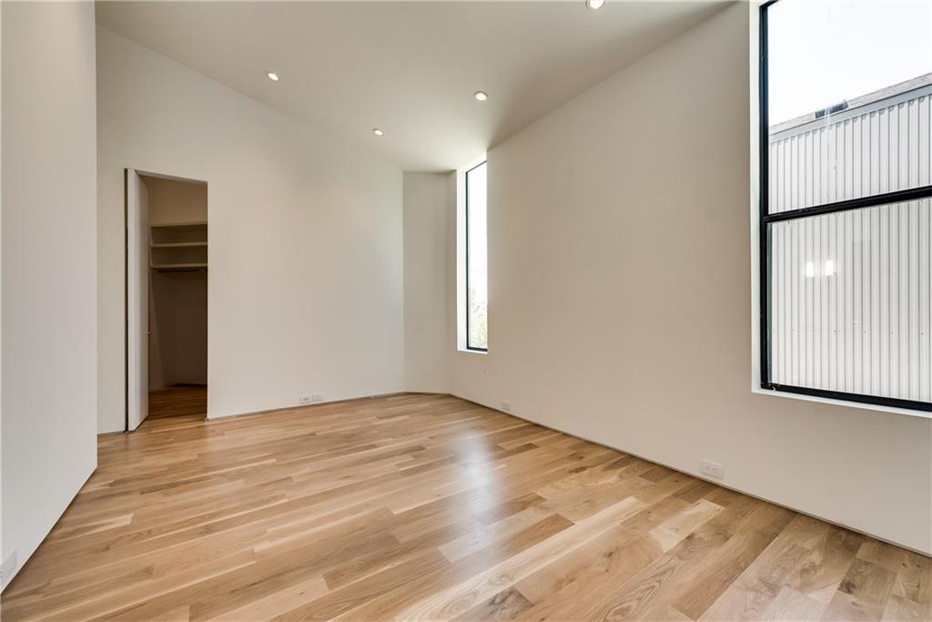 1504 Burlew Street, Unit 4 Dallas, TX 75204 - Photo 17 of 30 a view of an empty room with wooden floor