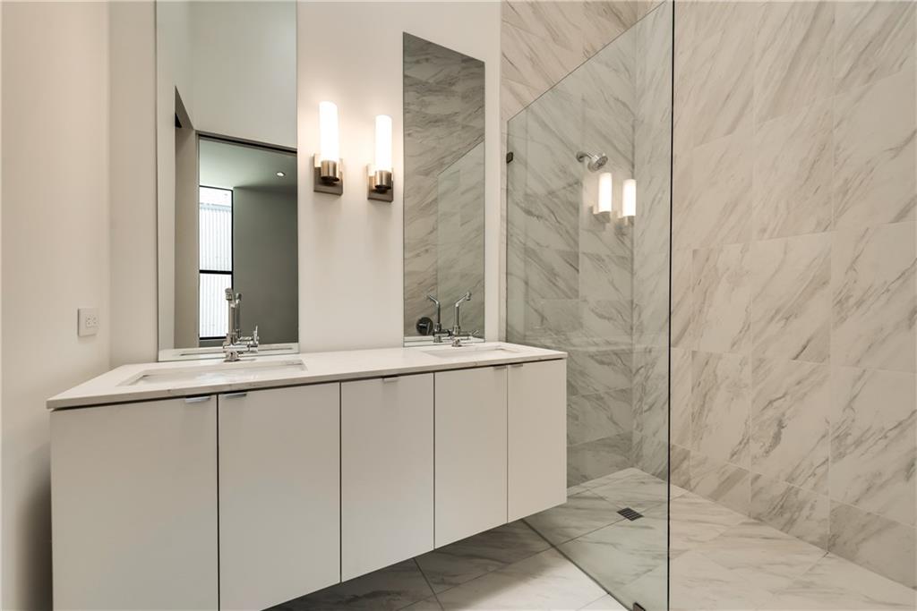 1504 Burlew Street, Unit 4 Dallas, TX 75204 - Photo 18 of 30 a bathroom with a sink and mirror
