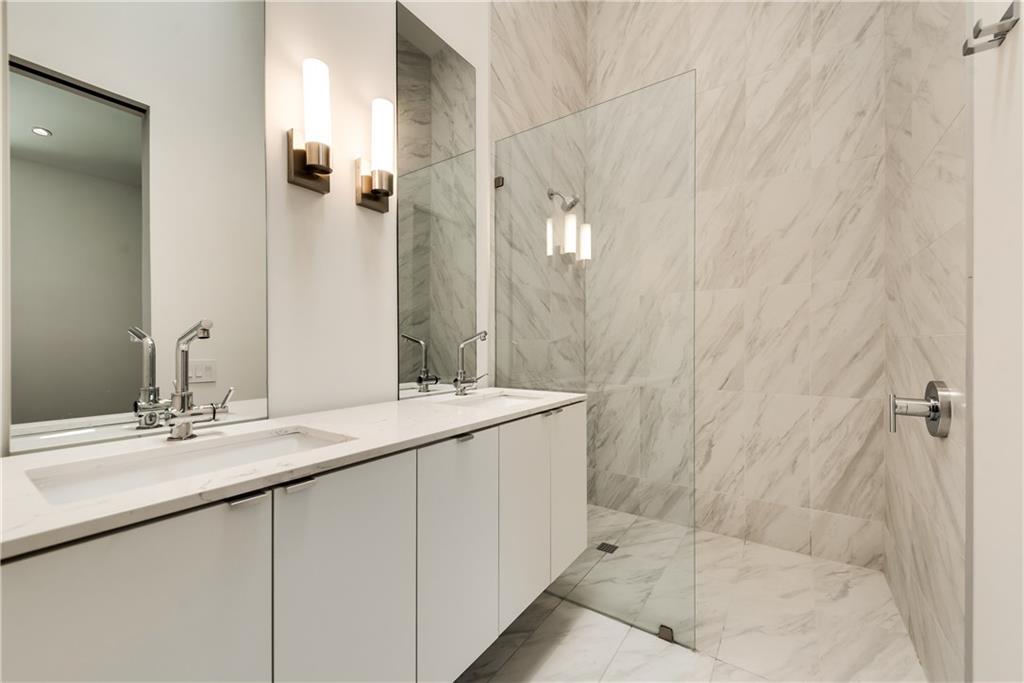1504 Burlew Street, Unit 4 Dallas, TX 75204 - Photo 19 of 30 a bathroom with a sink and a mirror